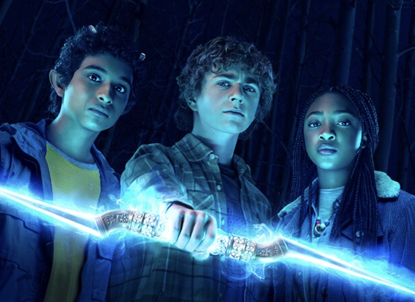 Walker Scobell (middle), Arayan Simhadri (left), and Leah Sava Jeffries (right) posing for a cover photo of the new Percy Jackson TV show. 
